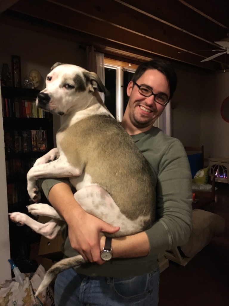 Photo of Aaron and his dog Artemis.